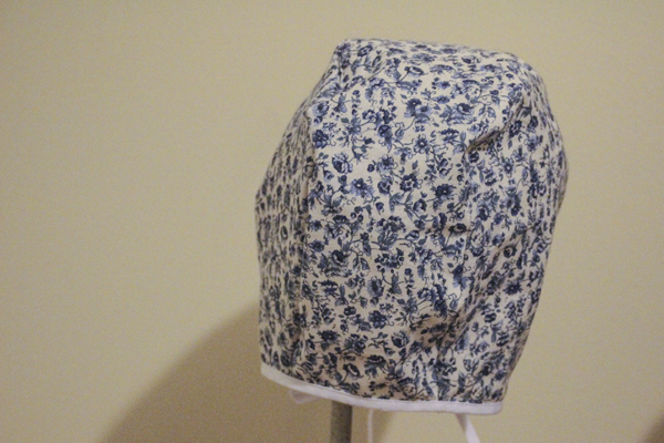 Back view of blue floral bonnet